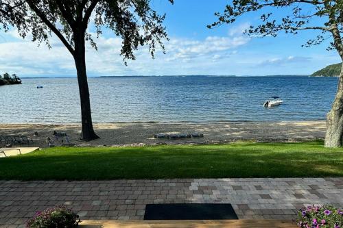 a lake with a boat in the water at Thayer Beach Lakehouse in Colchester