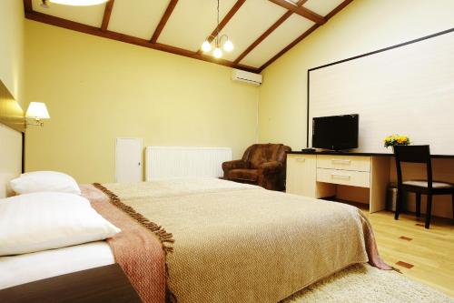 Postel nebo postele na pokoji v ubytování Mini-Hotel Under The Roof