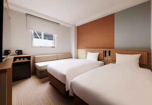 Postel nebo postele na pokoji v ubytování CVS Bay Hotel
