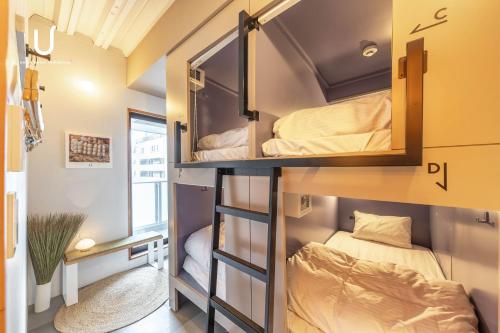 Postel nebo postele na pokoji v ubytování Hotel Residence Asakusa by unito