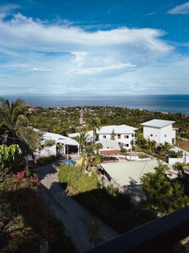 an aerial view of a town with the ocean at Seaview Mansion Dalaguete Apartment 3 in Dalaguete