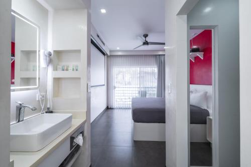 Un ou plusieurs lits dans un hébergement de l'établissement WET hotel - Adults Only