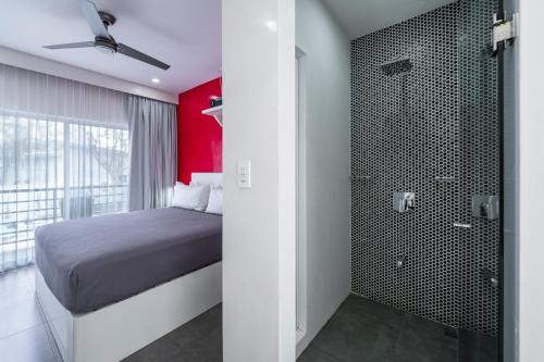 Un ou plusieurs lits dans un hébergement de l'établissement WET hotel - Adults Only