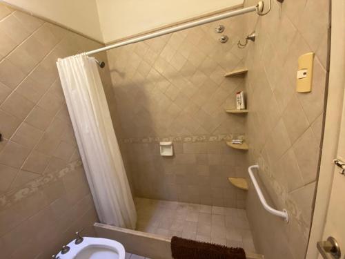 a bathroom with a shower and a toilet at Casa RINCON DEL SOL in Villa la Bolsa