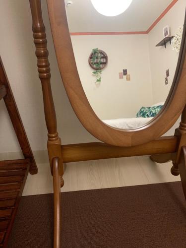 a mirror in a room with a bed at STAY MOMENT #Suwon in Suwon