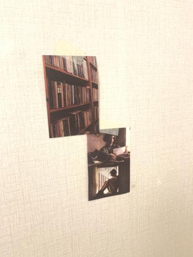 two photographs of two people sitting in a library at STAY MOMENT #Suwon in Suwon