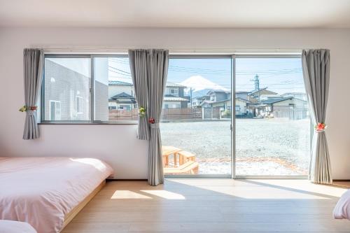 Postel nebo postele na pokoji v ubytování Private House Sora