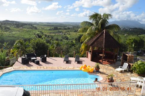 a swimming pool in a resort with a view at VillaPanoramic in Ducos