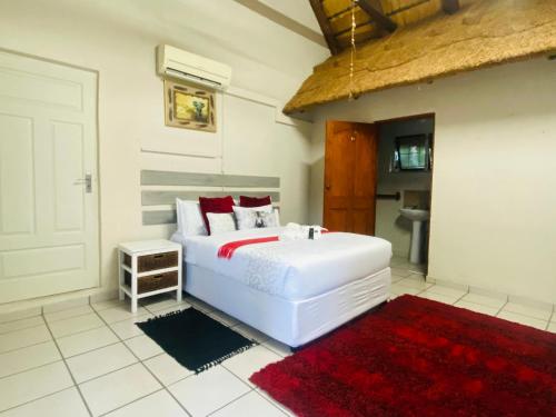 Ένα ή περισσότερα κρεβάτια σε δωμάτιο στο Richards Bay Airport Guest House The Comfort Zone