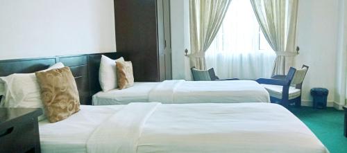 Katil atau katil-katil dalam bilik di The Rock Hotel