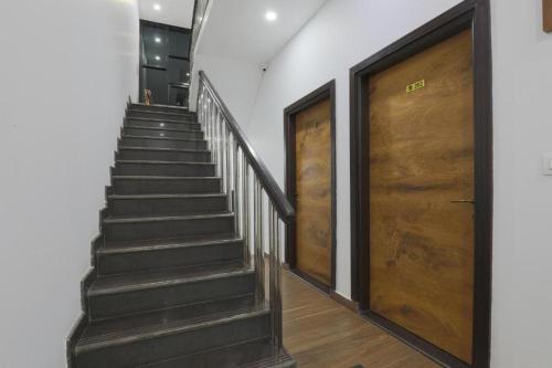 a staircase with two sets of doors in a building at Seaside Stay in Arambol
