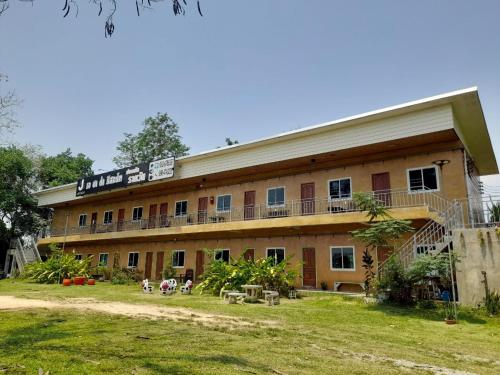 a large building with a lot of windows at Jayzada Fang Resort เจซาด้า รีสอร์ท in Fang
