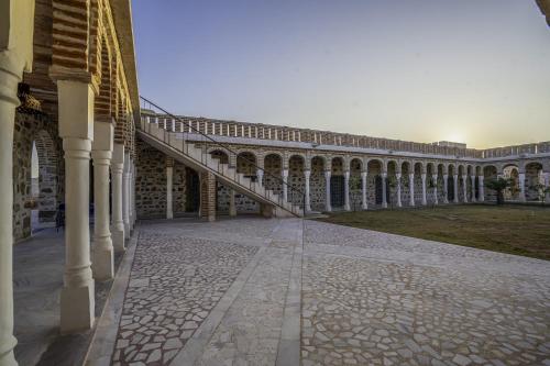 a building with a staircase on the side of it at Maya Luxury The Quila Udaipur in Udaipur