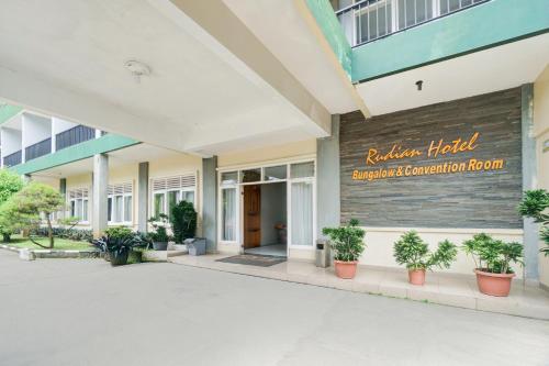 a building with a sign that reads reliance hotel evacuation coordination room at Hotel O Bogor near Taman Safari formerly Hotel Rudian 1 in Bogor