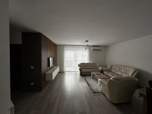 a living room with two couches and a television at ORG Apartment - Ferizaj in Ferizaj