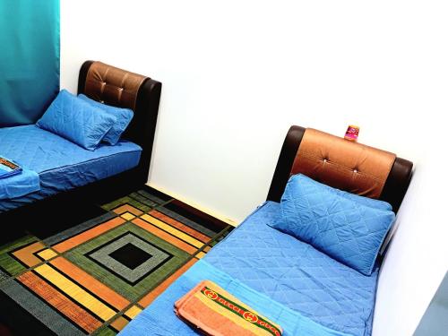 Ένα ή περισσότερα κρεβάτια σε δωμάτιο στο Homestay Nafisah Jasin Height - 3 Bedrooms