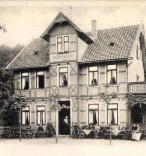 a black and white photo of a large house at Pension im Tal der Stille in Treseburg