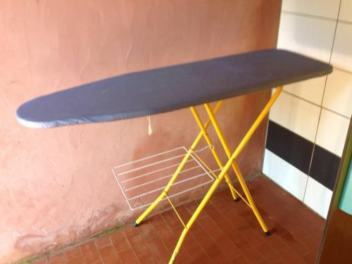 a table with a surfboard on top of it at Camping U STABIACCIU in Porto-Vecchio