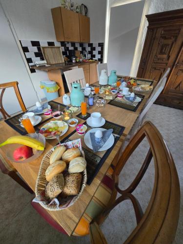 a wooden table with food on top of it at Pension im Tal der Stille in Treseburg