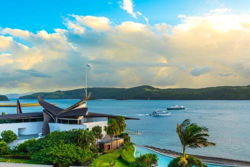 a view of a large body of water with boats at Yacht Club Villas on Hamilton Island by HIHA in Hamilton Island