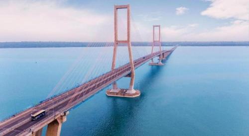 a bridge over a large body of water at Oriza Hotel Surabaya in Surabaya