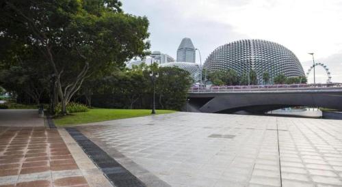 a bridge over a river with buildings in the background at Hotel 165 in Singapore