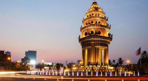 a building with a clock tower at night at Kirirom Crystal Hotel in Phnom Penh