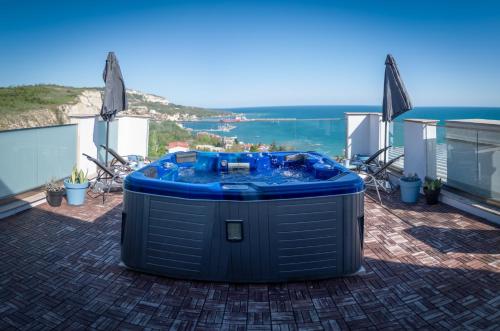 a hot tub sitting on top of a house at Queen's Penthouse Balchik apartment in Balchik