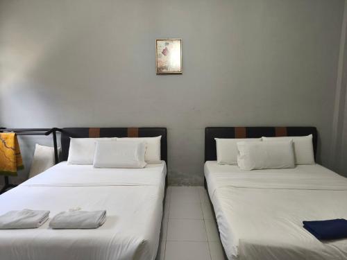Кровать или кровати в номере Hotel O Selesa Inn