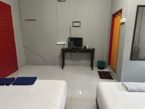Кровать или кровати в номере Hotel O Selesa Inn