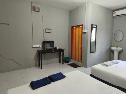 Кровать или кровати в номере Hotel O Selesa Inn