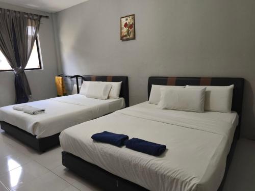 Кровать или кровати в номере Hotel O Selesa Inn