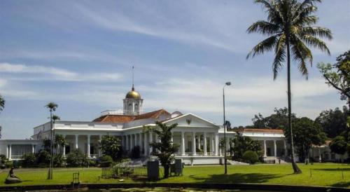 a white building with a gold dome on top of it at CICO Resort in Bogor