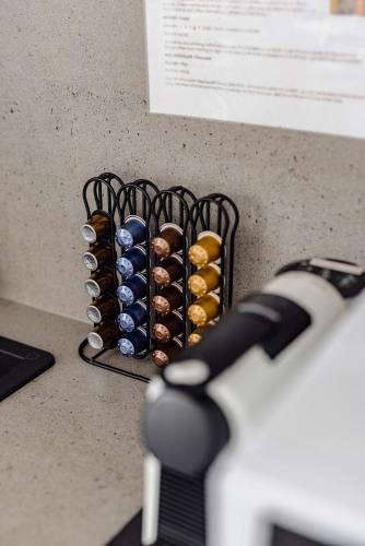 a wine rack with a bunch of wine bottles at Mala Retreat Sleeps 7, Two Bedrooms & Ensuites in East Maitland