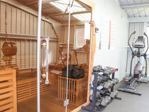 a room with a gym with tread machines at Larch in Newtonmore