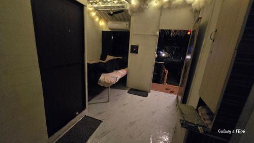 a view of a room with a bed and a hallway at Sea - Touch Beach Resort Harihareshwar in Harihareshwar