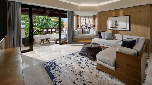 a living room with a couch and a table at Grand Hyatt Bali in Nusa Dua