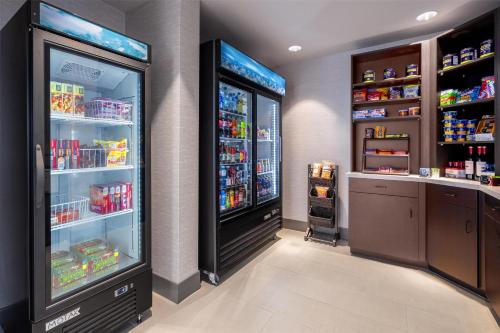 a store with two large refrigerators in a room at DoubleTree by Hilton Sioux City in Sioux City
