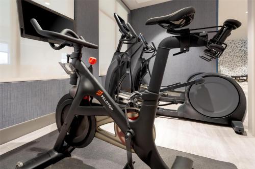 a gym with two exercise bikes in a room at DoubleTree by Hilton Sioux City in Sioux City
