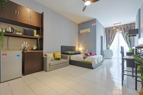 a room with a bed and a refrigerator in it at 5mins to Sunway Pyramid #Subang SS15 Cozy Studio Menara Rajawali in Subang Jaya