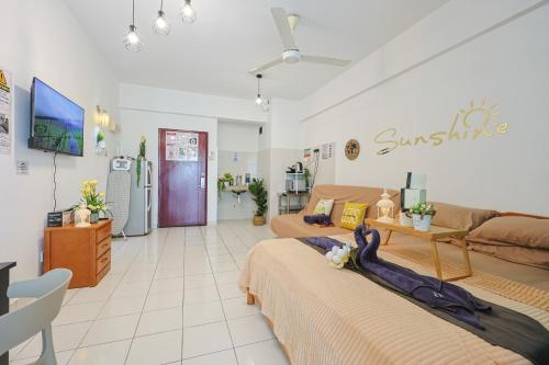 a living room with two beds and a couch at 5mins to Sunway Pyramid #Subang SS15 Cozy Studio Menara Rajawali in Subang Jaya