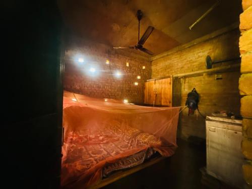 Postel nebo postele na pokoji v ubytování Ashok Homestay
