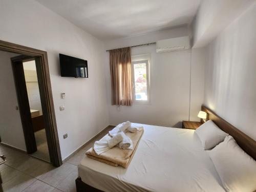 Кровать или кровати в номере Tarra Rooms and Apartments