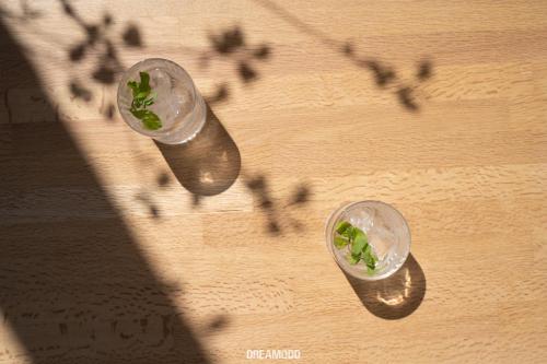 two glass cups with plants in them on a table at Edem Boutique Suites in Oia