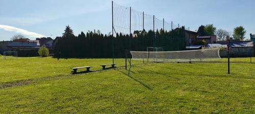 a soccer field with a net and a bench at Apartament Turysty Zamczysko in Zamość