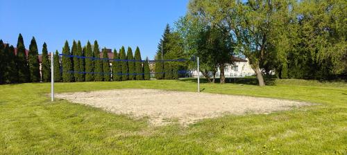 a volleyball net in the middle of a field at Apartament Turysty Zamczysko in Zamość