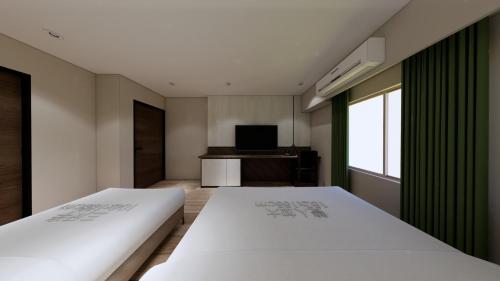 Postel nebo postele na pokoji v ubytování Milan Motel
