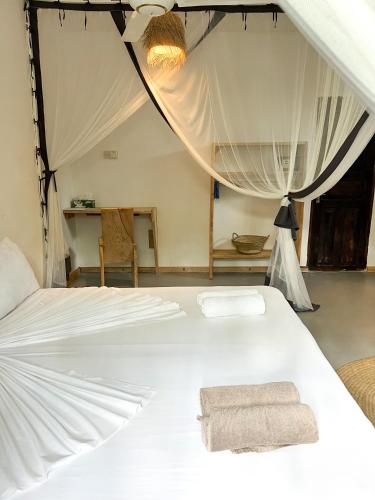 Кровать или кровати в номере Tunda Lodge