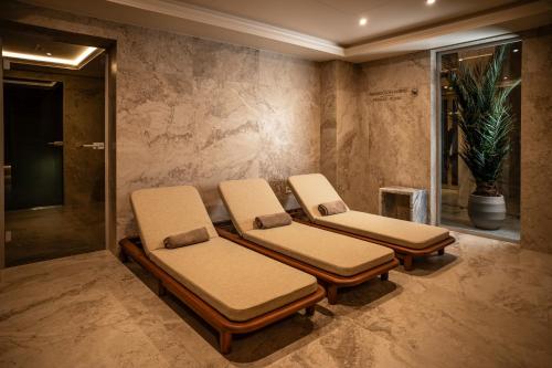 a room with three massage chairs in a room at Nadiya Palace in Ivano-Frankivsʼk