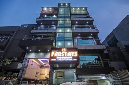 a tall building with a sign in front of it at Hotel Fab Stays in New Delhi